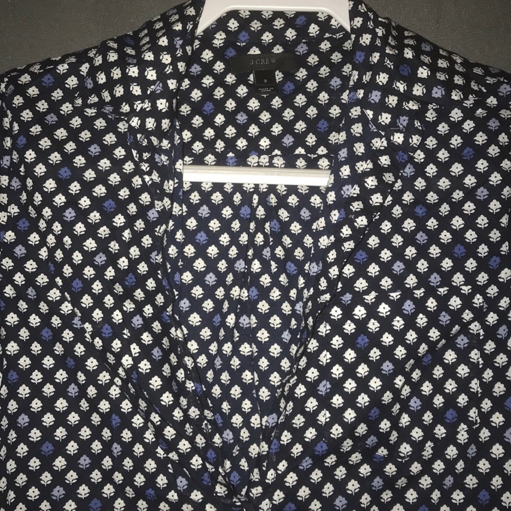 Long sleeve tee. Black and white with blue flower.